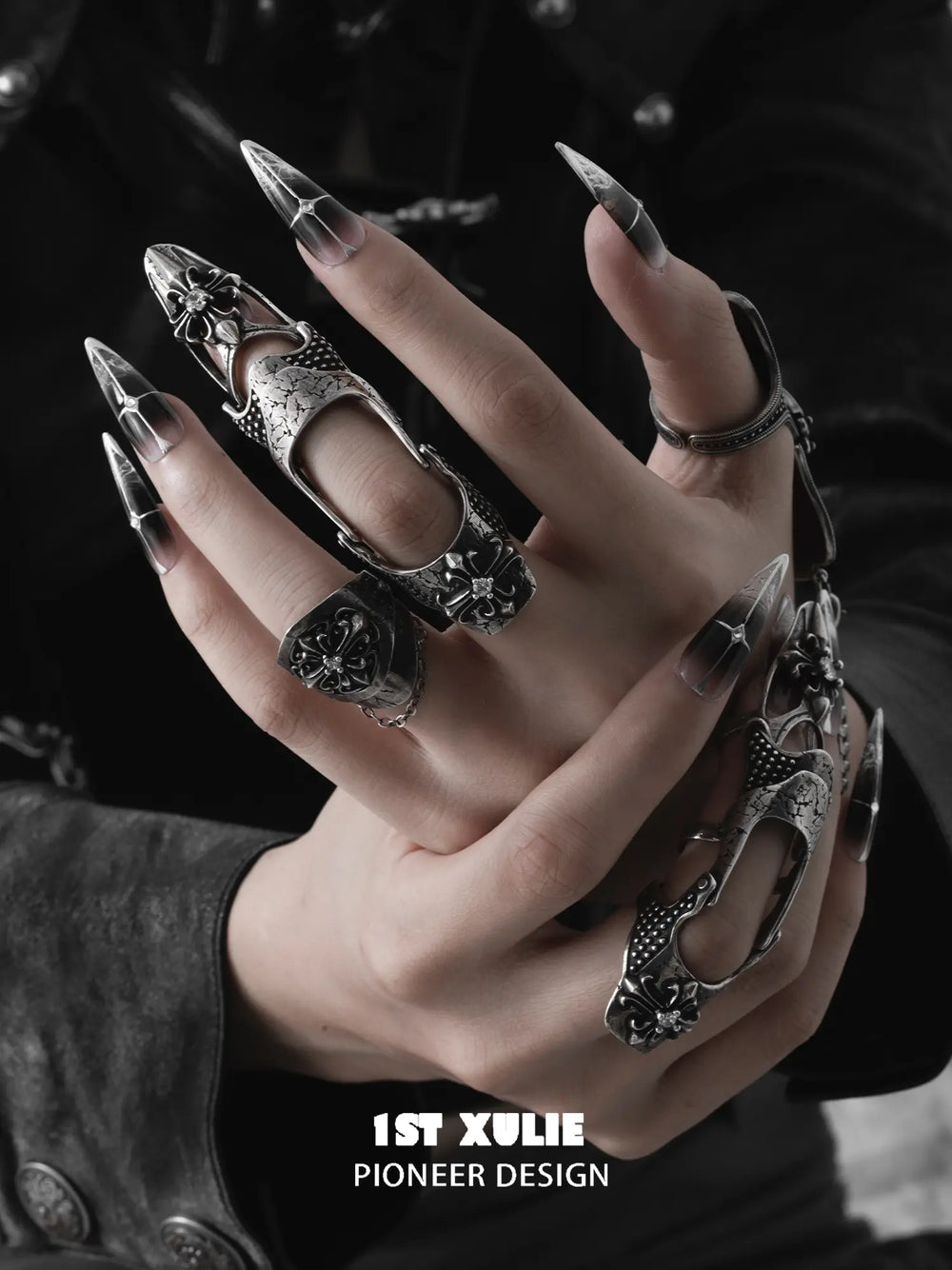 Gothic chain signet and long armor rings worn with coordinating jewelry