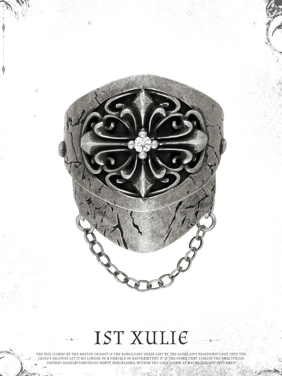 Short gothic signet ring against a pale decorative border