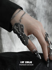 Thumb armor ring and wrist chain worn on the hand