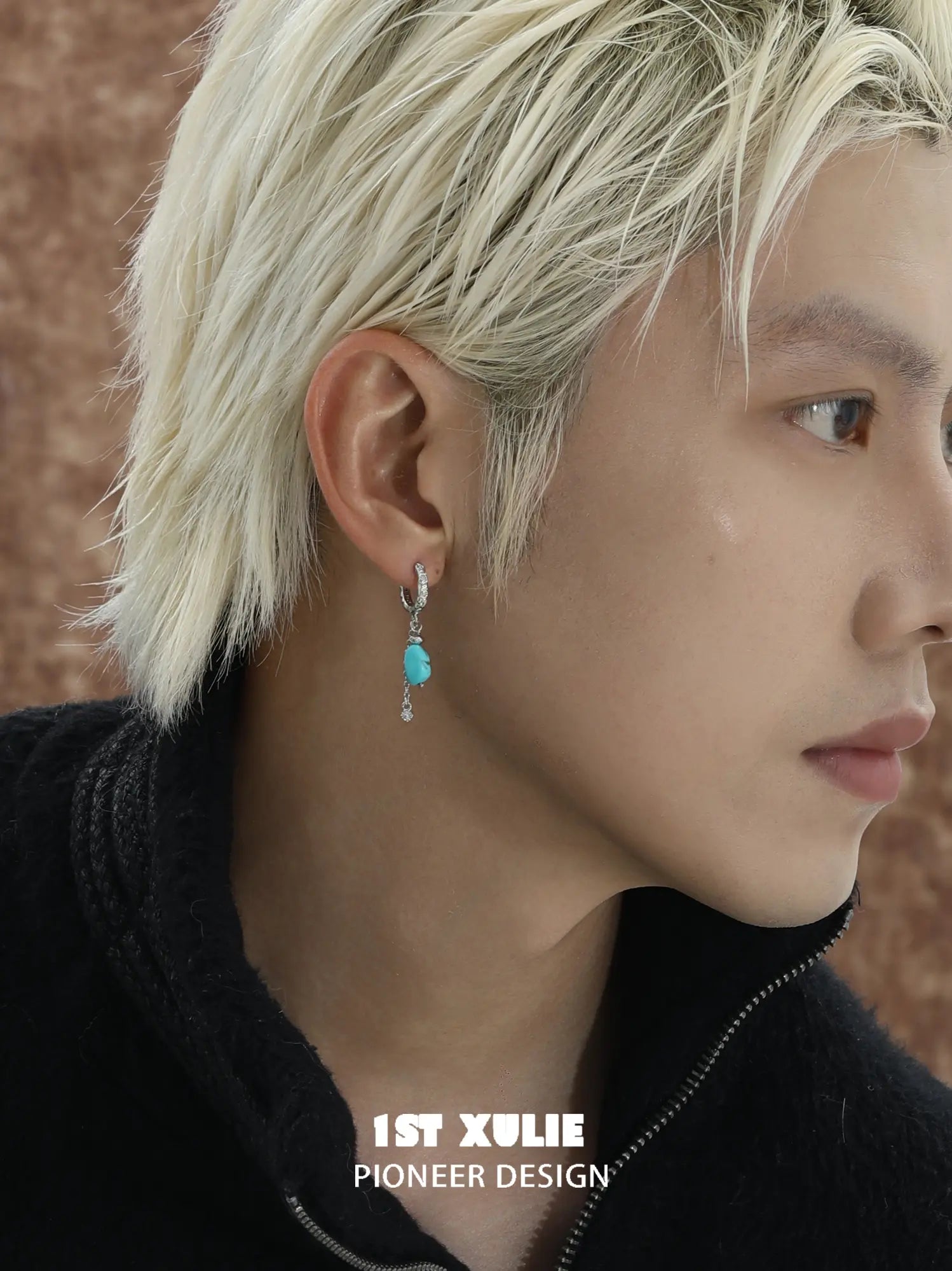 Natural turquoise drop hoop earrings worn on the ear