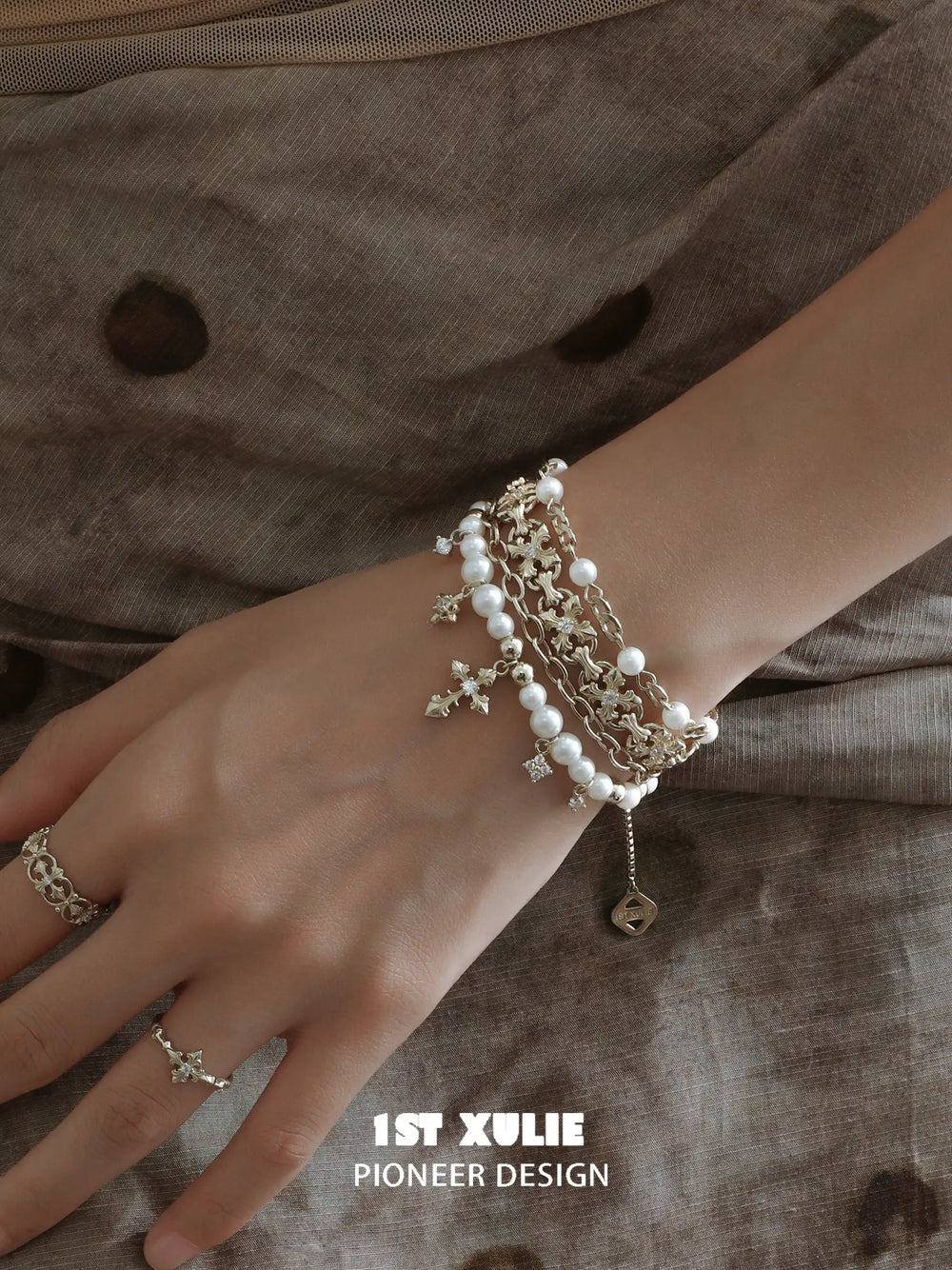Side view of the layered pearl-bead bracelet on a wrist