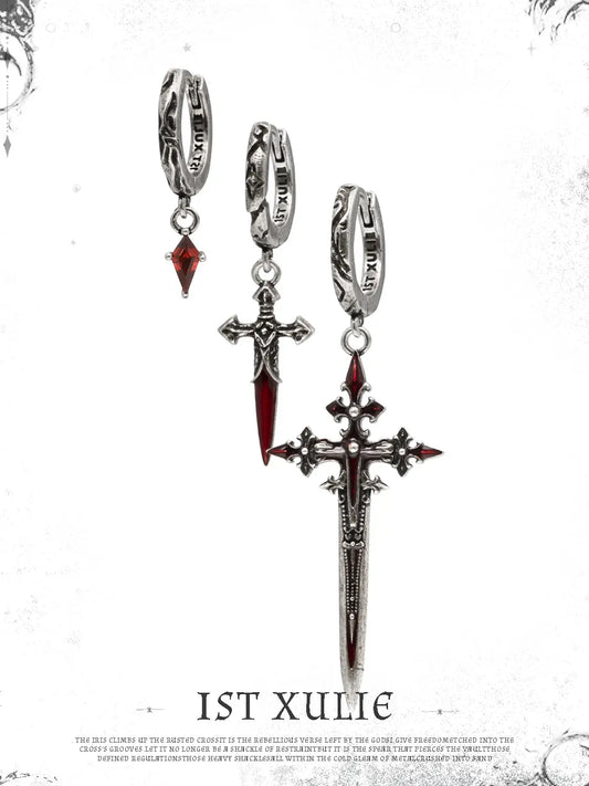 Red drop and dagger hoop earrings showing the ornamental details and overall silhouette