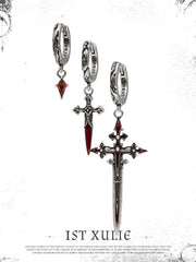 Red drop and dagger hoop earrings showing the ornamental details and overall silhouette