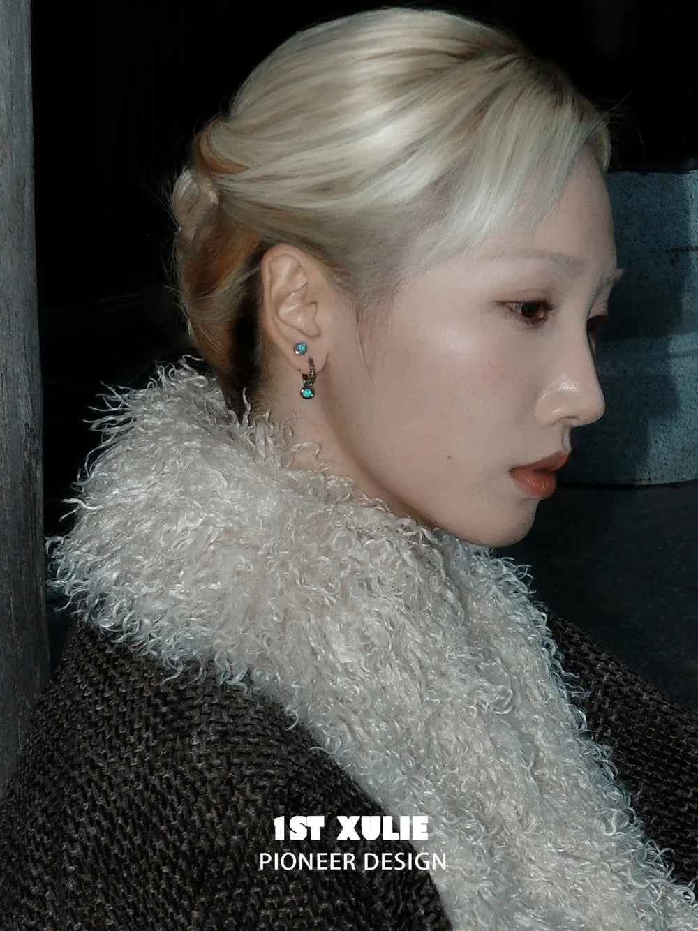 Round composite turquoise hoop and stud earrings worn on the ear
