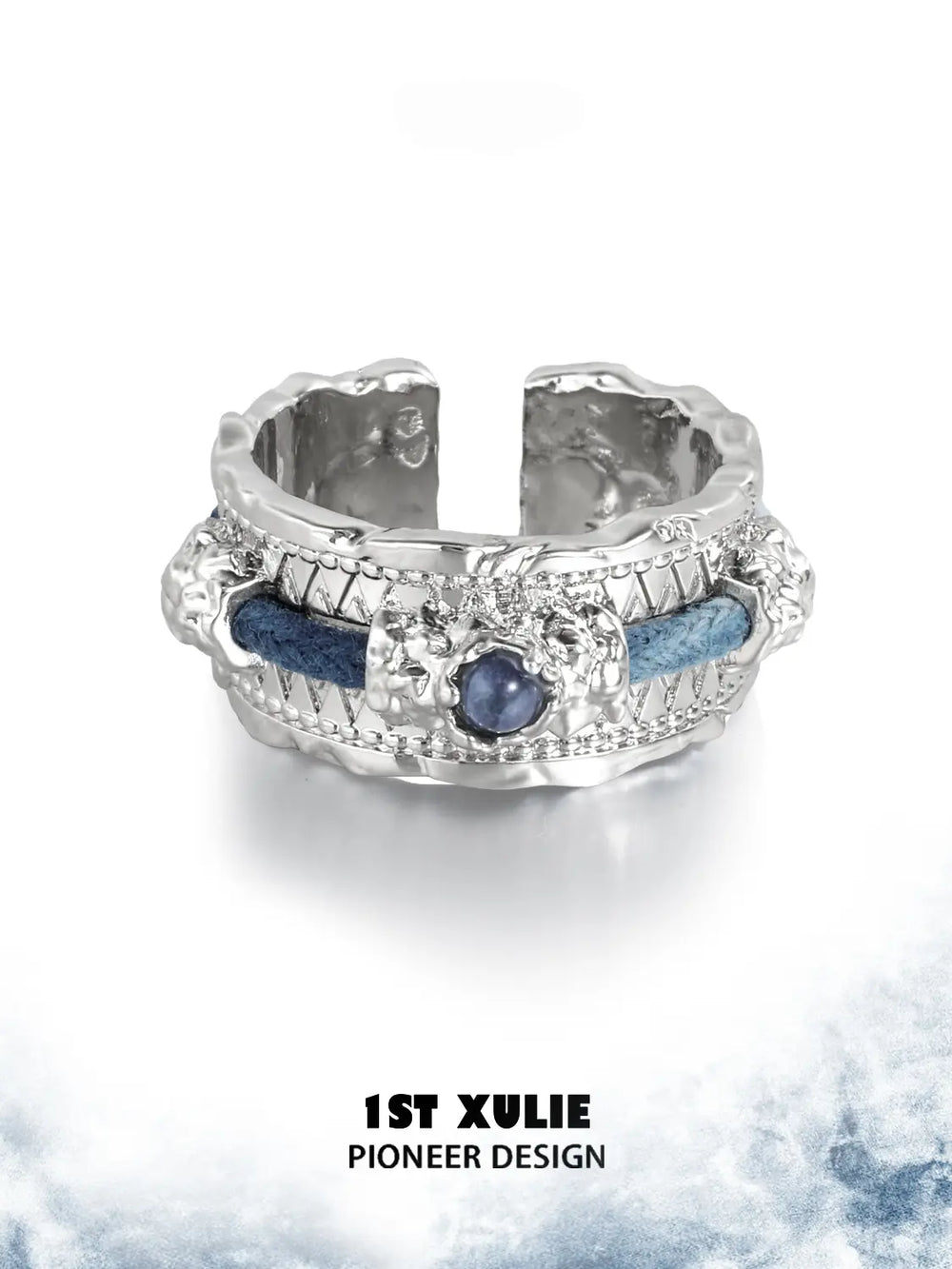 Wide blue woven ring displayed against a light cloud-pattern background